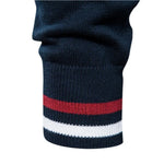 Ribbed sweater cuff with navy, red, and white horizontal stripes