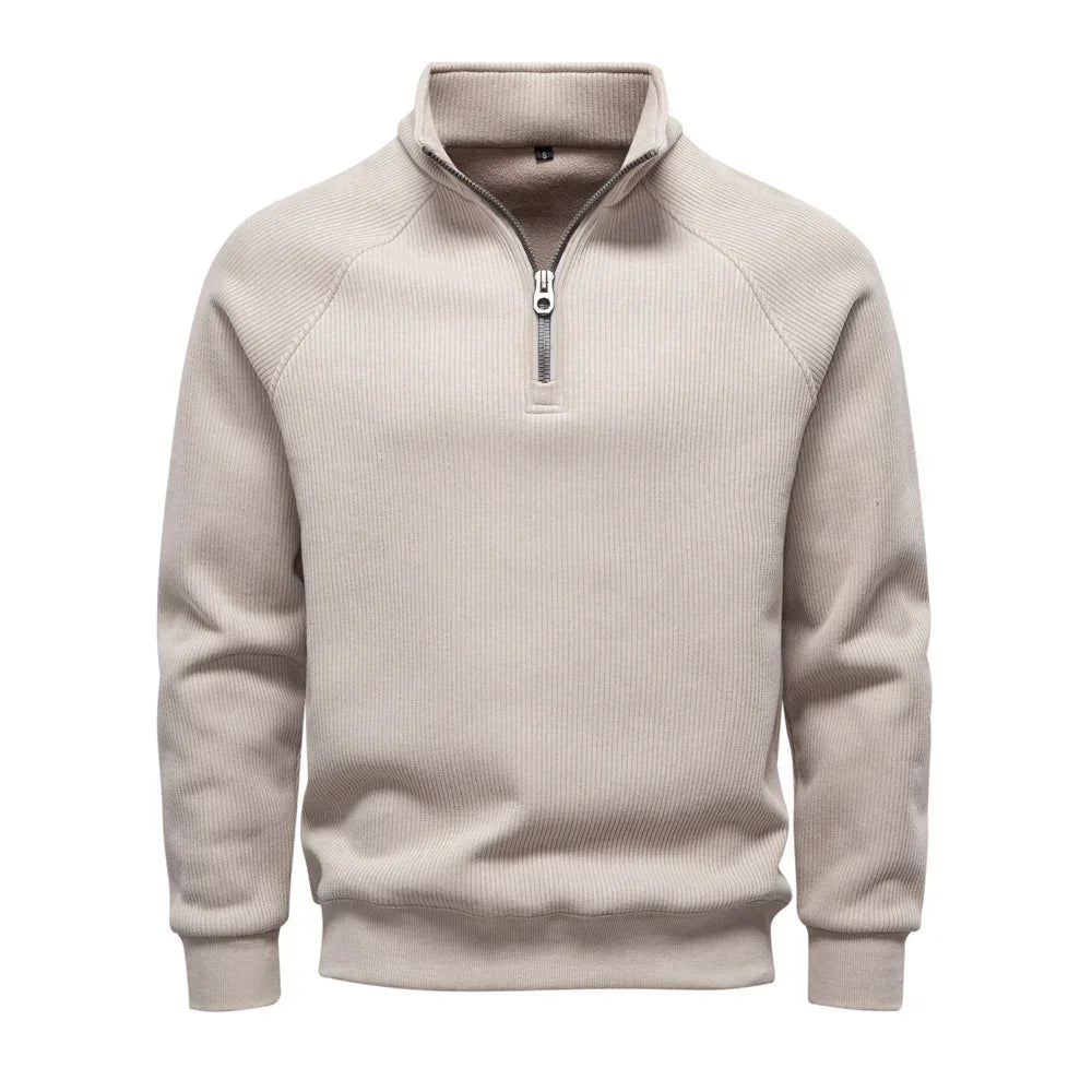 Men's beige quarter-zip sweater with stand collar and ribbed cuffs and hem.