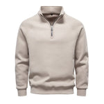 Men's beige quarter-zip sweater with stand collar and ribbed cuffs and hem.