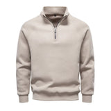 Men's beige quarter-zip sweater with stand collar and ribbed cuffs and hem.