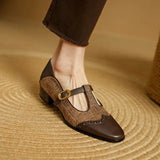 Front-left view of two-tone leather buckle shoes with low block heel