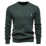 Men's dark green cable-knit crewneck sweater with long sleeves and small chest logo