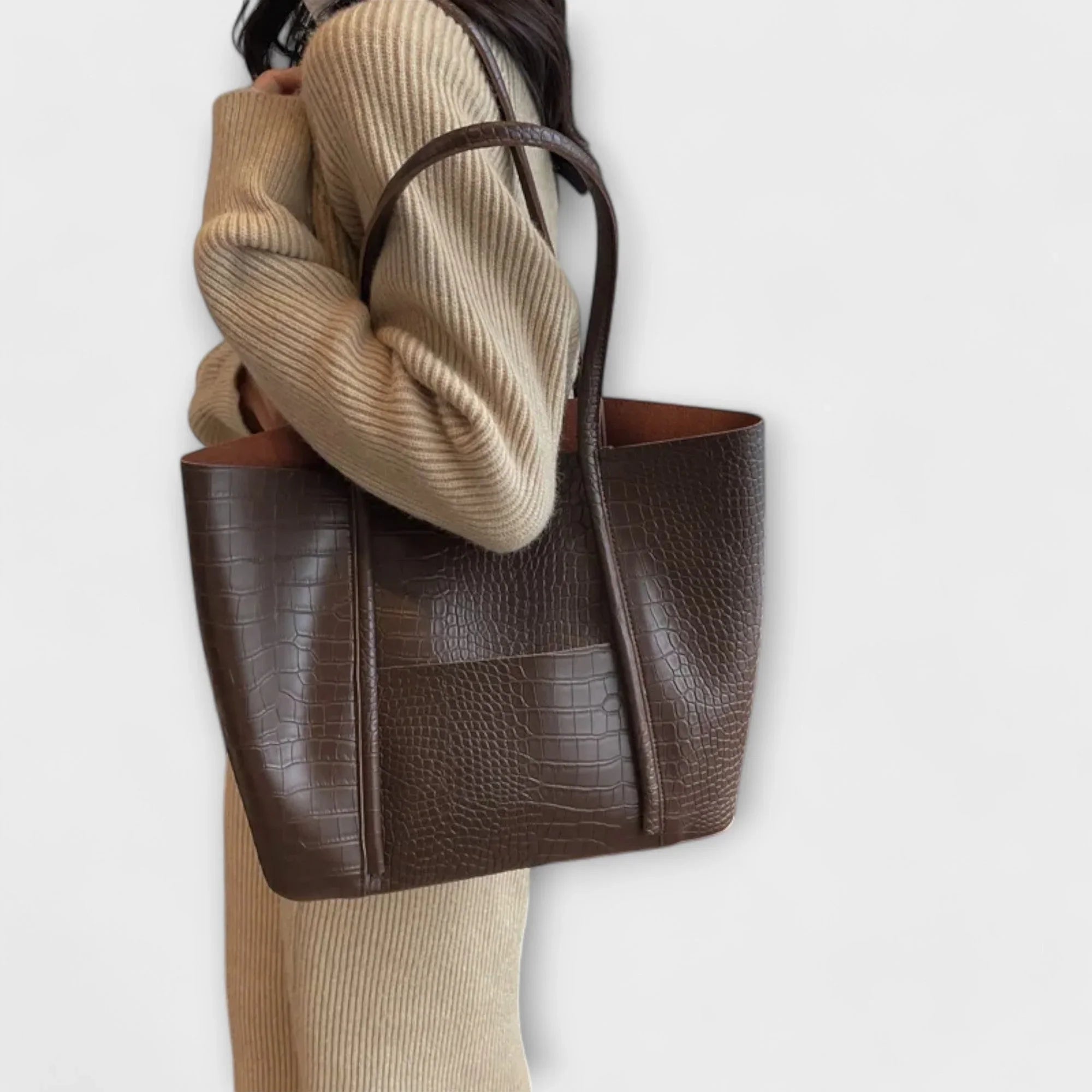 Beige croc-embossed leather tote bag with wide handles and open top