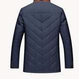 Navy quilted winter jacket back view with chevron stitching and brown collar trim