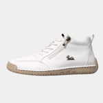 White orthopedic comfort high-top sneakers with lace-up and side zipper.