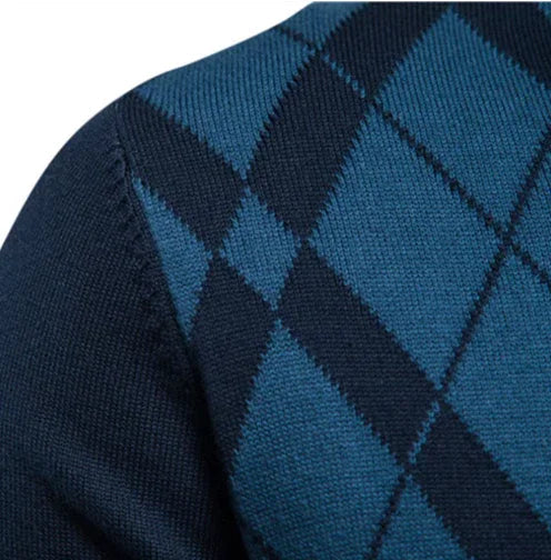 Men's argyle knit sweater detail, blue and dark diamond pattern