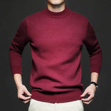 Burgundy high-neck knit sweater with long sleeves and ribbed cuffs.