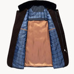 Navy jacket interior view with plaid lining, orange inner panel, and hooded collar