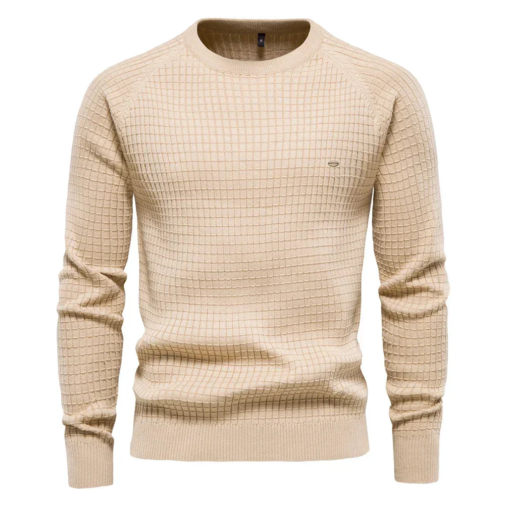 Men's beige knit pullover sweater with crew neck, ribbed cuffs and hem, small chest logo.