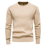 Men's beige knit pullover sweater with crew neck, ribbed cuffs and hem, small chest logo.