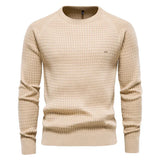 Men's beige knit pullover sweater with crew neck, ribbed cuffs and hem, small chest logo.