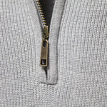 Men's light gray knit pullover with half-zip and metal zipper pull