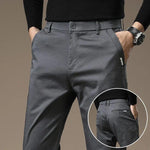 Cement gray slim chino pants with button closure and belt loops, tapered legs