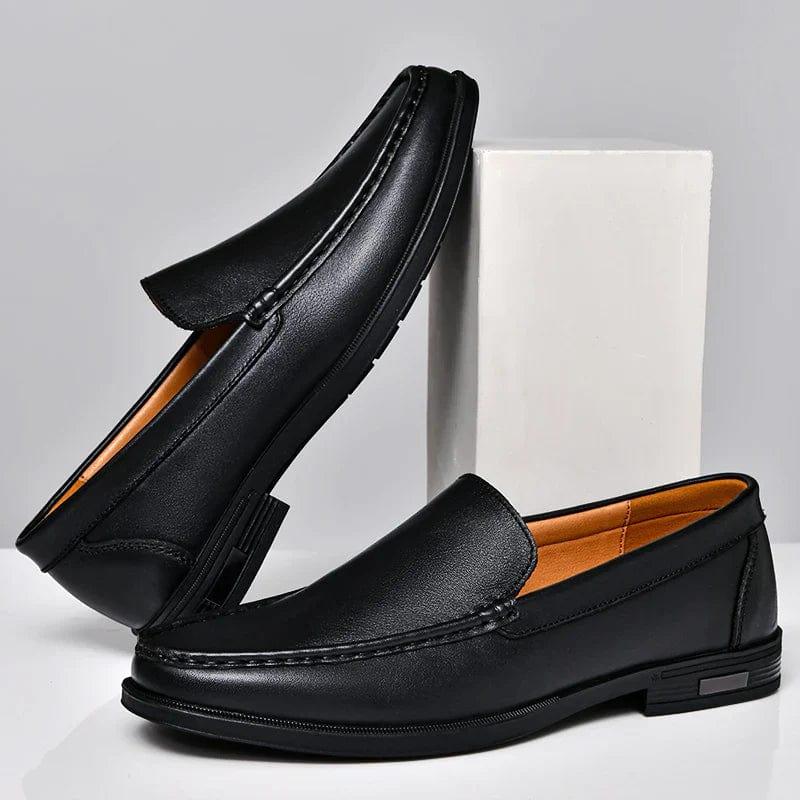Black leather loafer slip-on with strap detail and low block heel