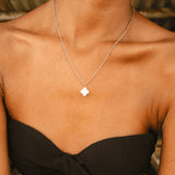 Silver pendant necklace with white clover charm
