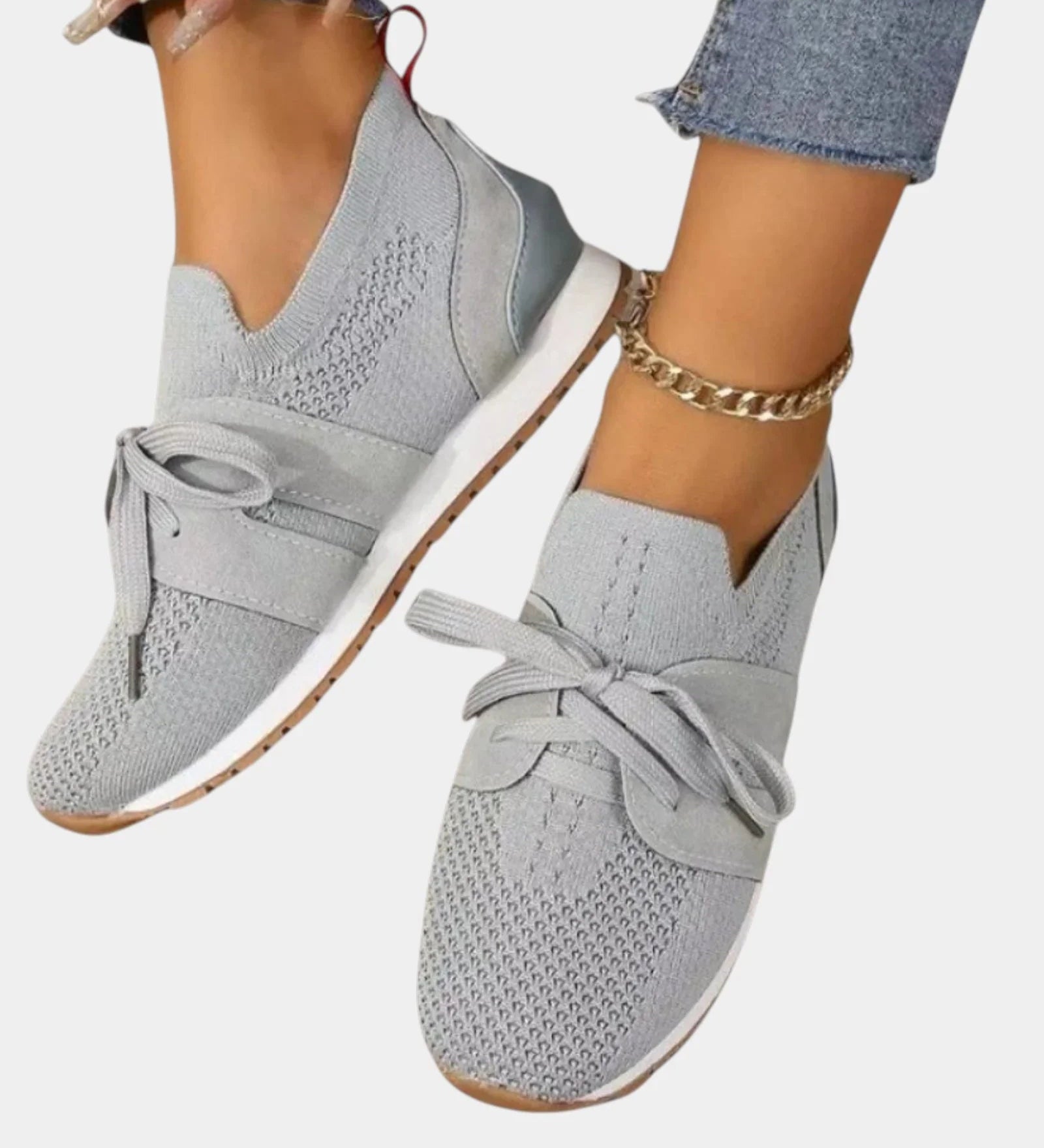 Gray lace-up orthopedic sneakers with textured knit upper and light rubber sole