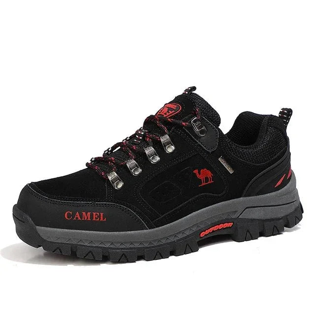Black mountain boots with red accents, lace-up with metal eyelets, thick tread sole