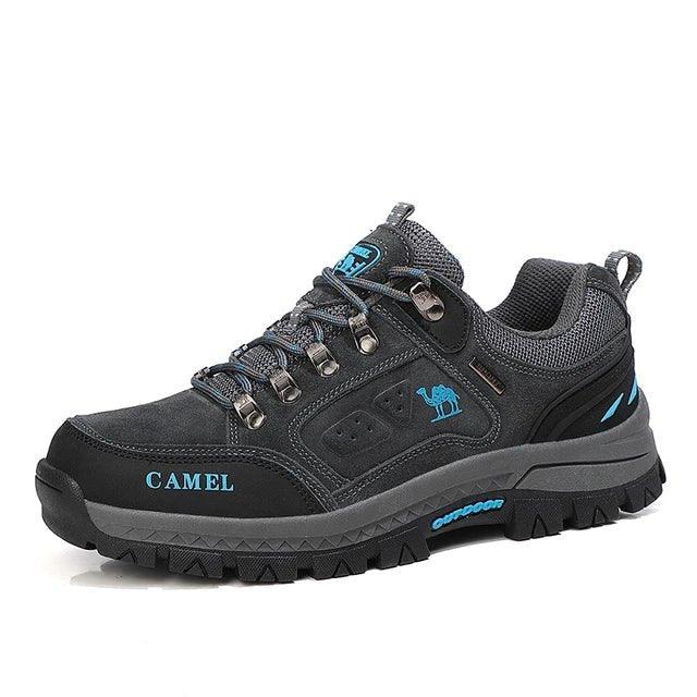 Dark gray mountain boots with teal logo and lace details, lace-up, grippy tread