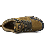 Brown suede lace-up mountain boot with mesh lining and padded tongue, rugged tread
