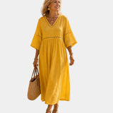 Mustard yellow midi dress with V-neck, short sleeves, embroidered trim, gathered waist