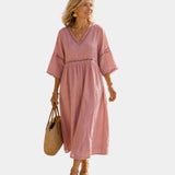 Blush pink midi dress with V-neck, short sleeves, embroidered yoke, gathered waist
