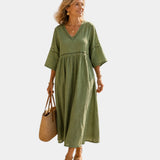 Olive green midi dress with V-neck, short sleeves, embroidered trim, gathered waist