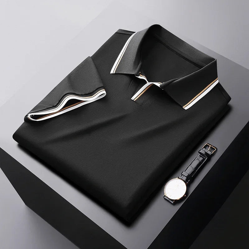 Black soft silk polo shirt, folded flat with contrast-trim collar