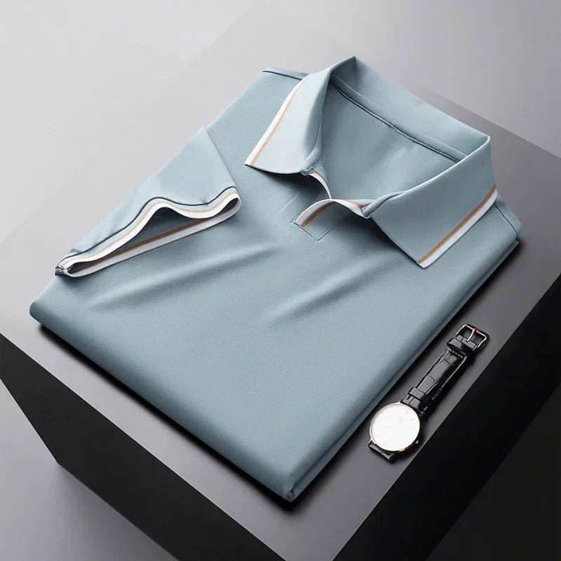 Light blue soft silk polo shirt, folded flat with contrast-trim collar