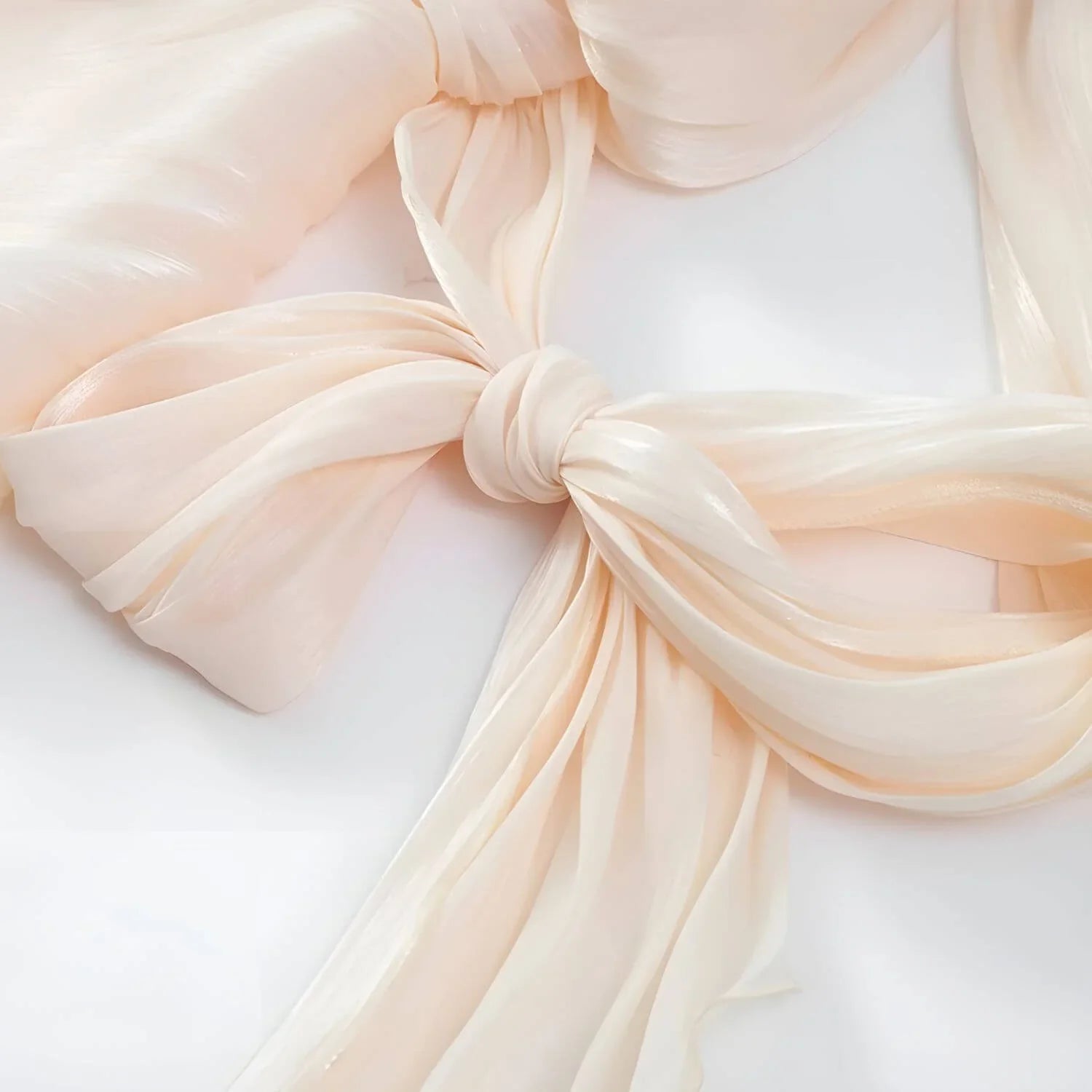Monique Delicate Radiance ivory dress waist bow drape and flowing chiffon fabric