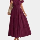 Burgundy tiered maxi dress with V-neck, short sleeves, and cinched gathered waist