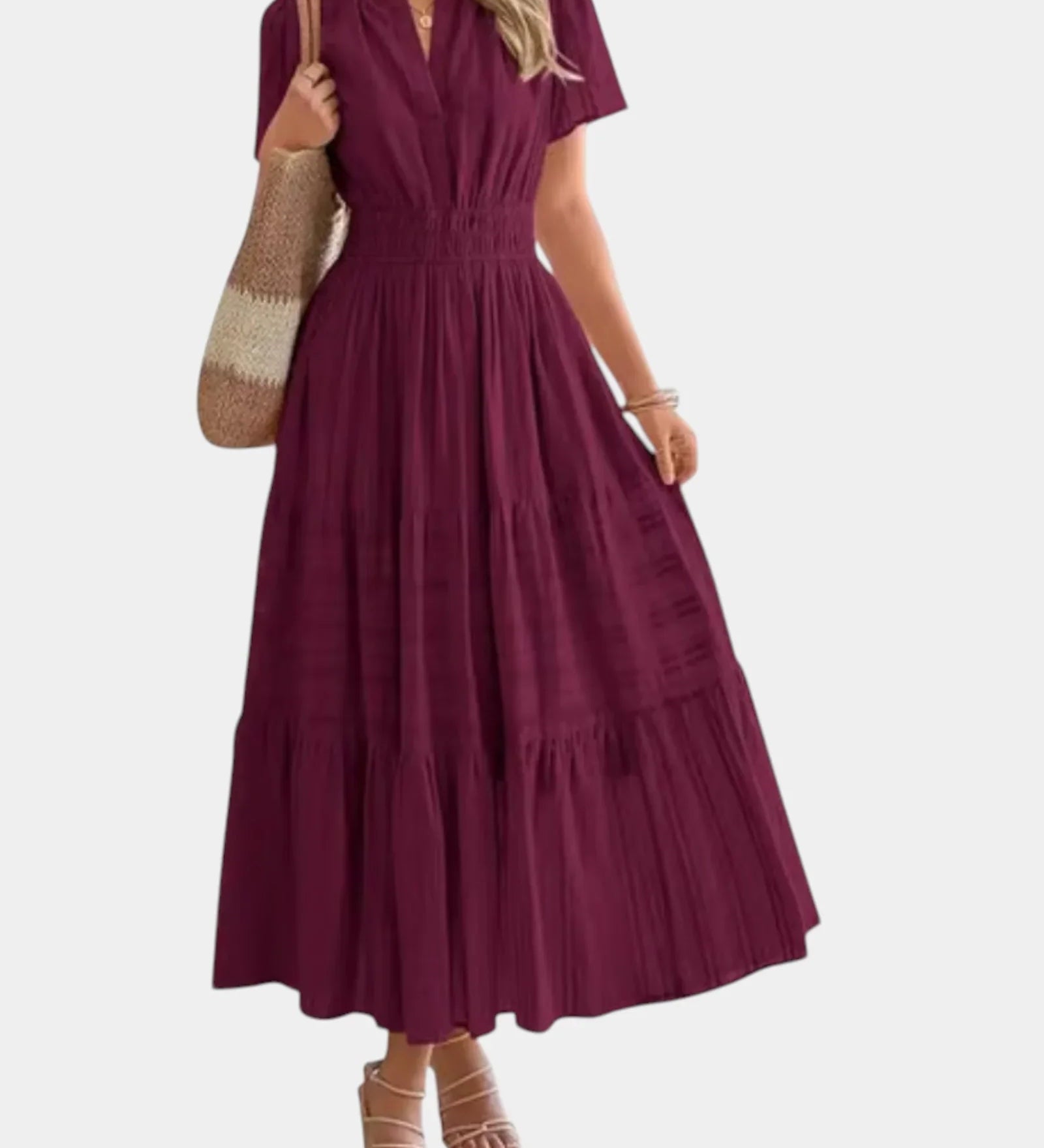 Burgundy tiered maxi dress with V-neck, short sleeves, and cinched gathered waist