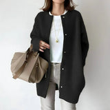 Black button-front long cardigan with long sleeves and round neckline, relaxed fit.