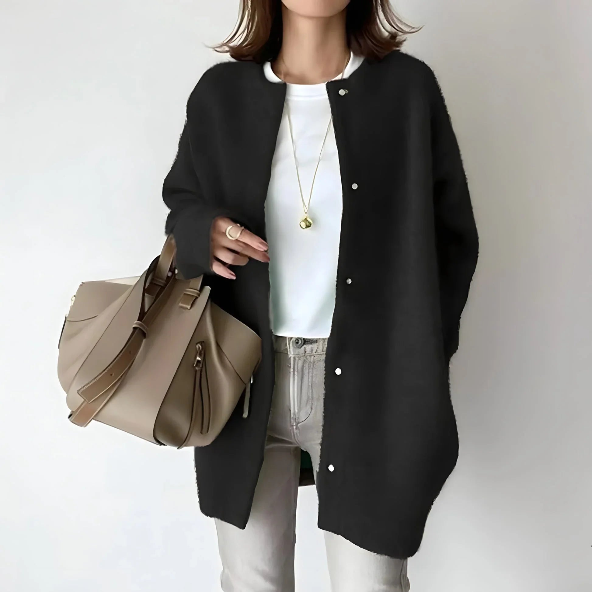 Black button-front long cardigan with long sleeves and round neckline, relaxed fit.
