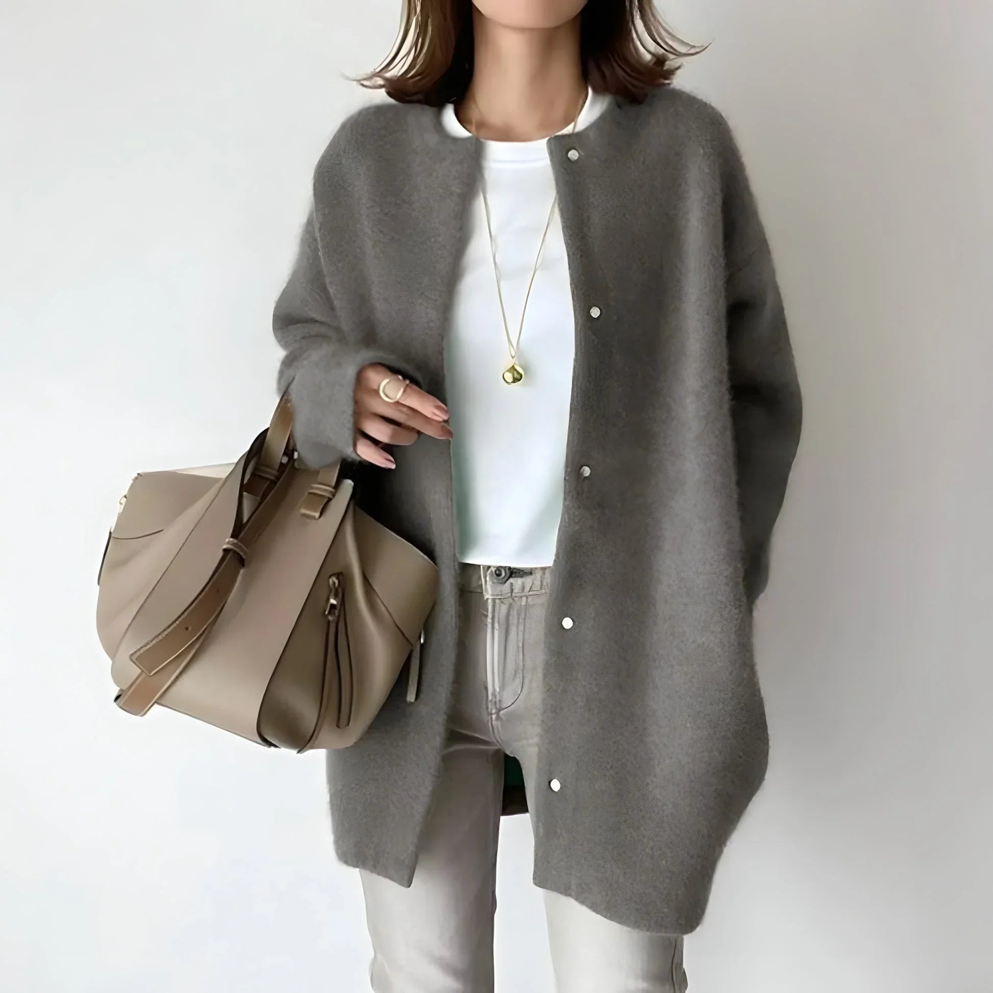 Gray button-front cardigan with long sleeves and round neckline, relaxed and loose.