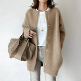 Light brown button-front cardigan with long sleeves and round neckline, relaxed fit.