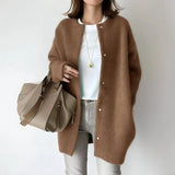 Brown button-front long cardigan, relaxed fit with round neck and long sleeves.