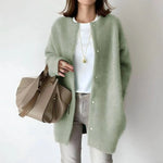 Sage green button-front cardigan with long sleeves and round neckline, draped fit.