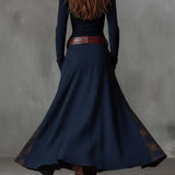 Navy back view vintage maxi dress with fitted bodice, flared skirt, button details