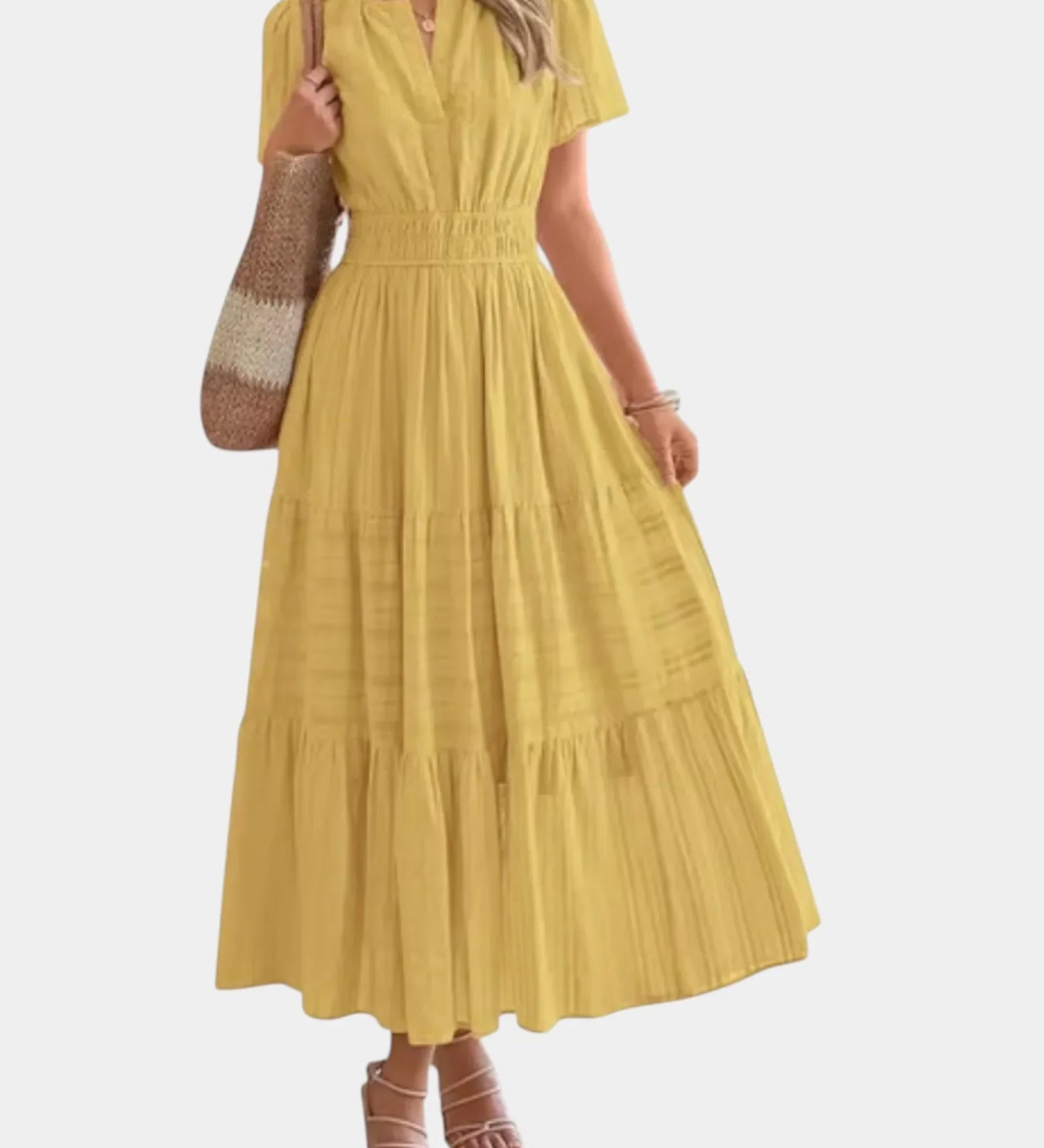 Yellow tiered maxi dress with V-neck, short sleeves, and gathered waist detail