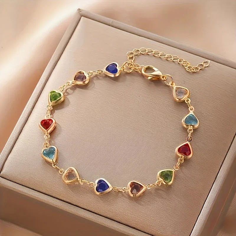 Gold-tone heart charm bracelet in box, multicolor heart stones