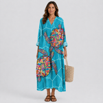 Women's teal V-neck summer dress with colorful abstract print and 3/4 sleeves