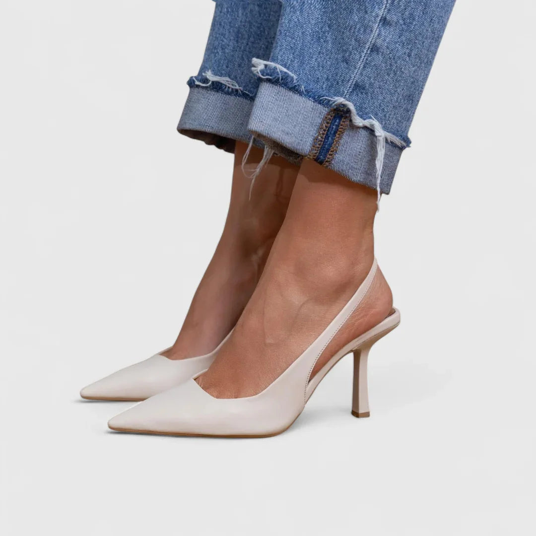 White pointed-toe heeled slingback with low block heel