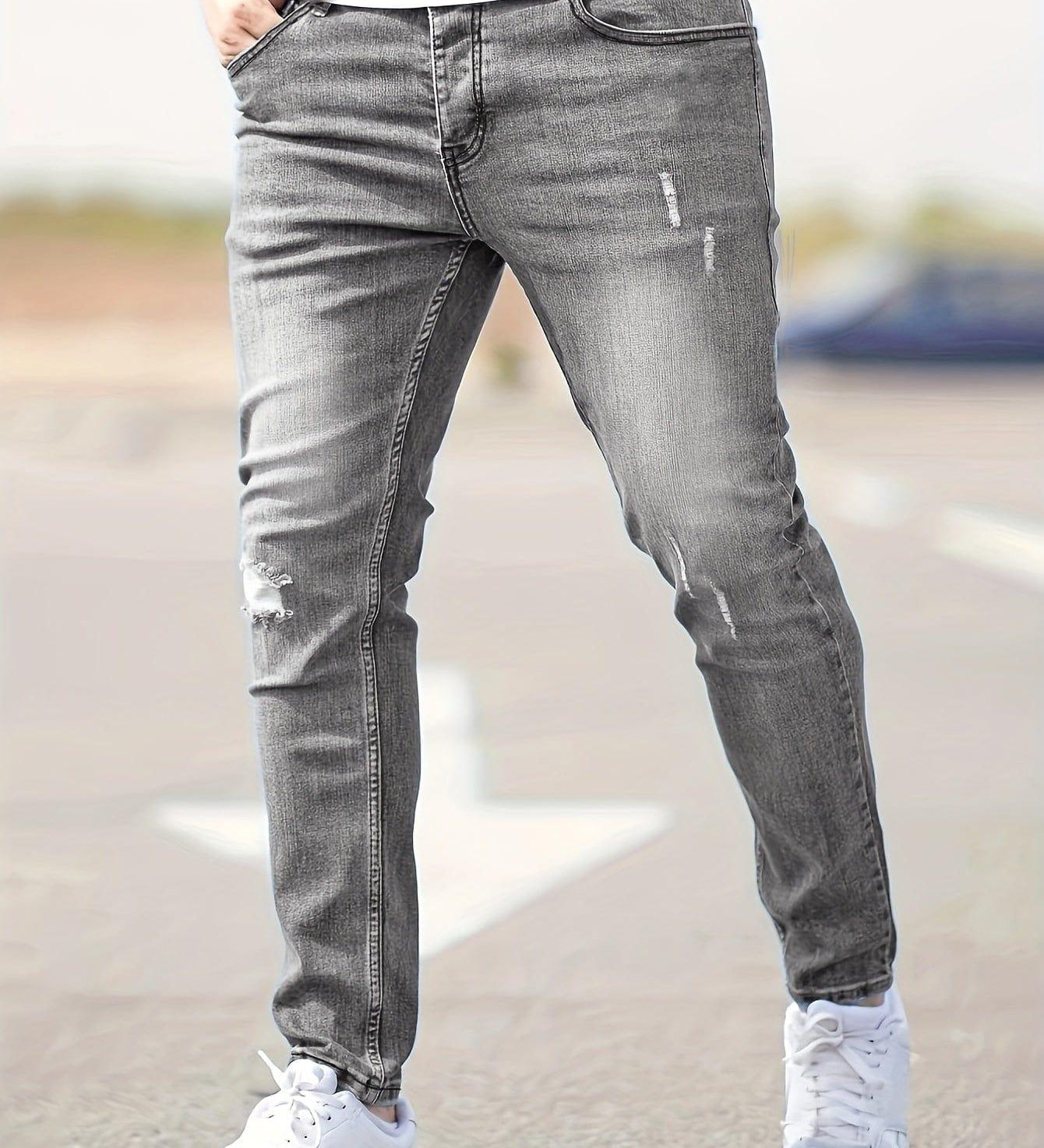 Slim-fit ripped jeans in light gray wash, distressed knees and fitted taper