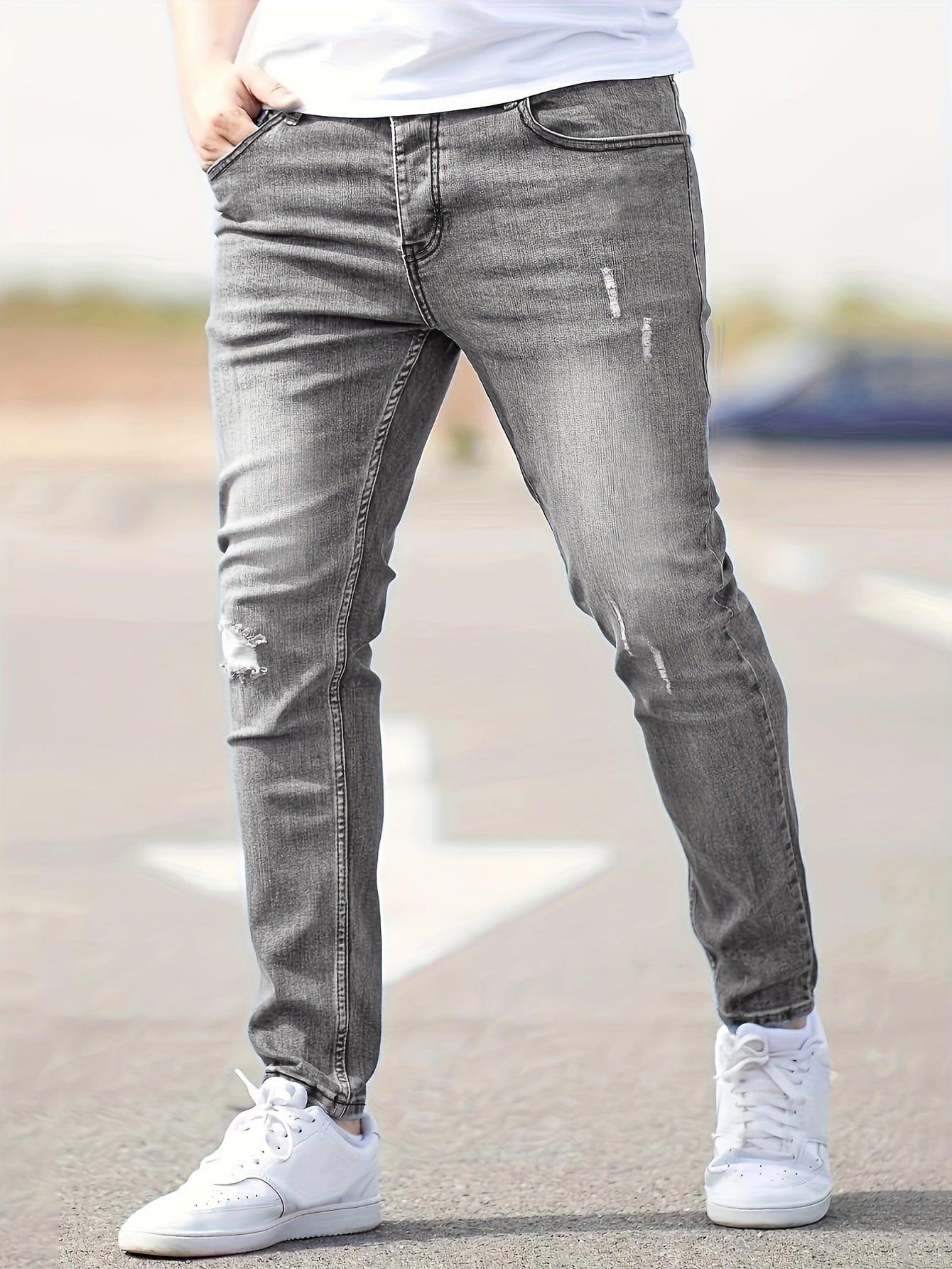 Slim-fit ripped jeans in light gray wash, distressed knees and fitted taper