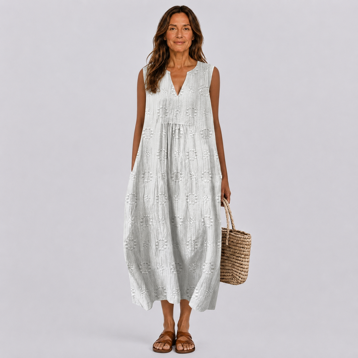 White sleeveless tiered summer dress with V-neck and textured embroidery