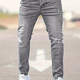Slim-fit ripped jeans in gray wash, ripped knee details and tapered fit