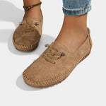 Brown suede lace-up loafers with stitched moc toe and low heel sole.
