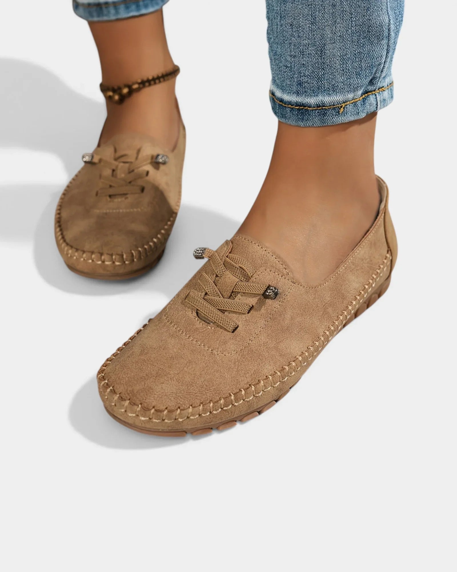 Brown suede lace-up loafers with stitched moc toe and low heel sole.