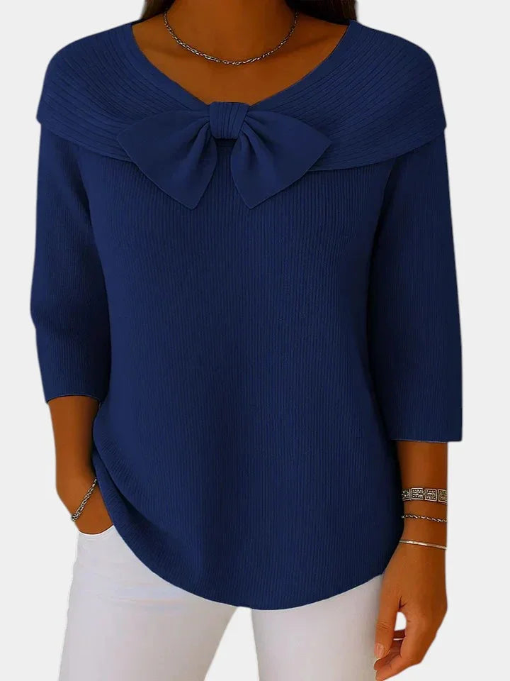 Navy blue ribbed knit top with bow-knot neckline and 3/4 sleeves