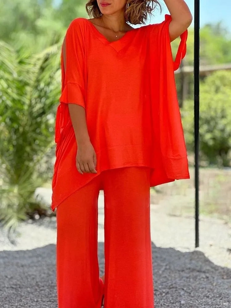 Orange V-neck tunic with draped sleeves and wide-leg pants set